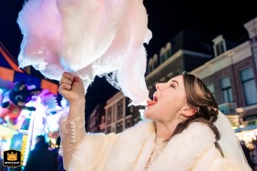   In the city of Leiden, a wedding day sugar rush of cotton candy is delightfully captured, revealing the playful side and bright spirits of the celebration.